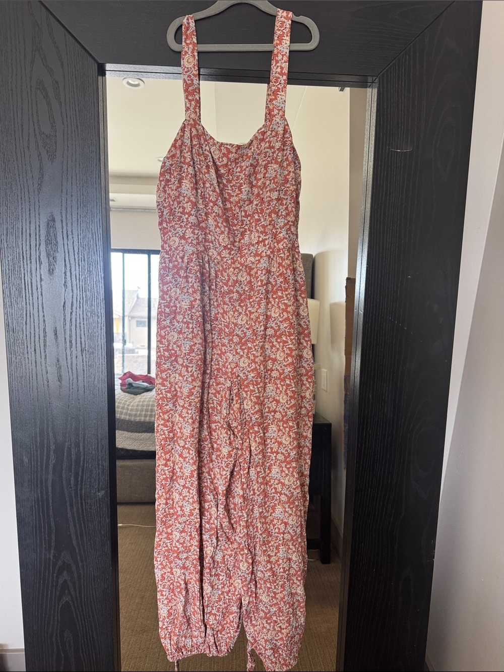 Women’s rust colored floral jumpsuit